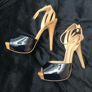 Black and Tan hight heeled pumps.